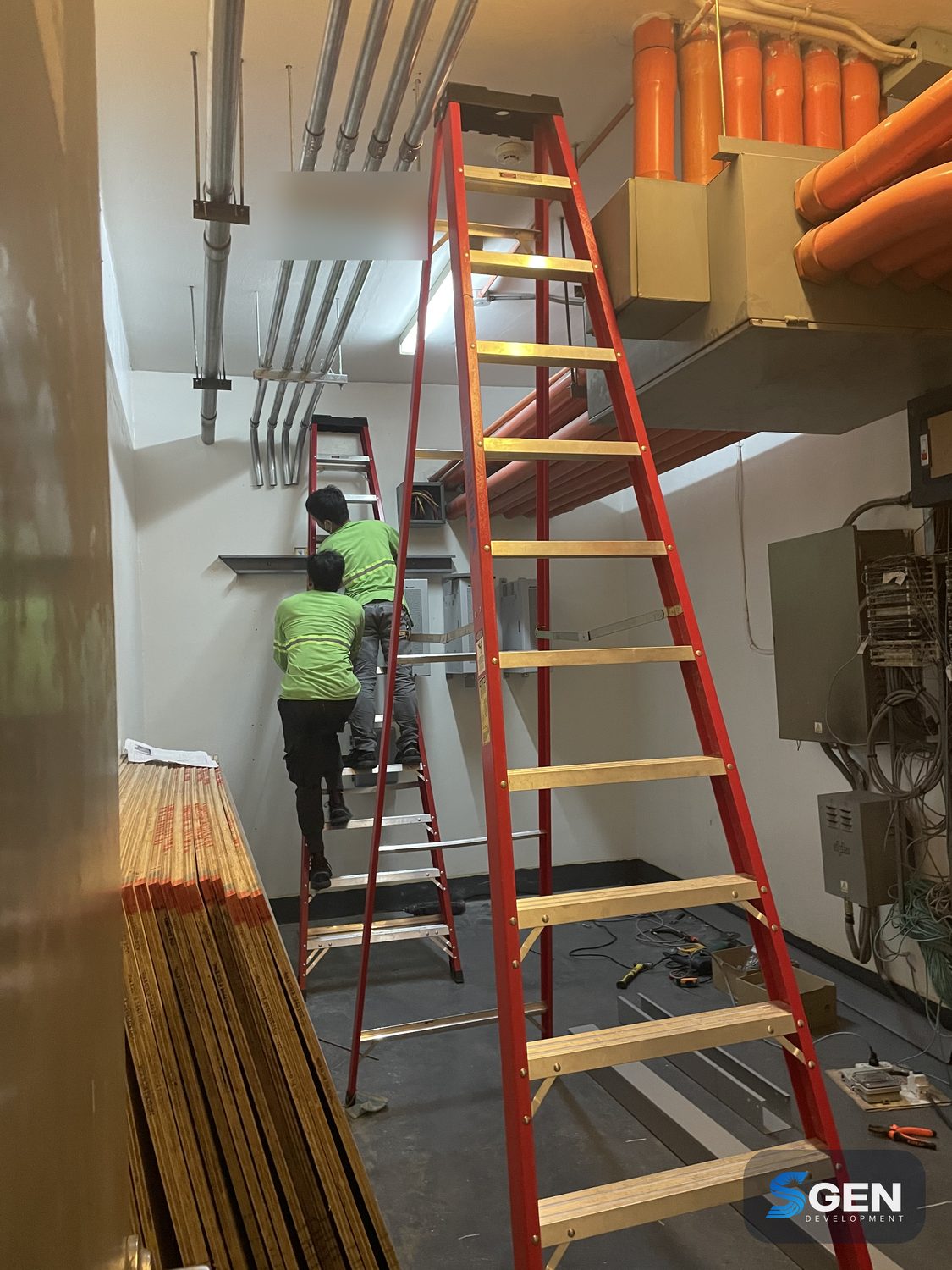 Galvanized conduit and cable-tray installation in a building services room